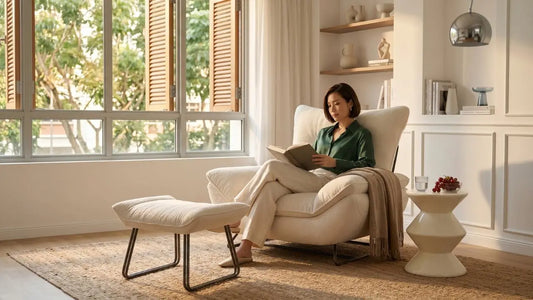 Accent armchair with matching ottoman beside window in a bright Singapore living room