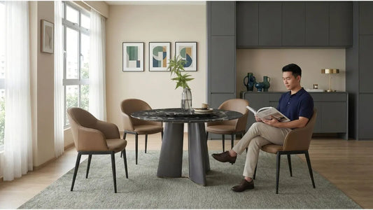Armless dining chairs with a round black dining table in a compact HDB dining area