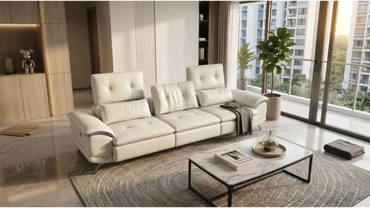 White reclining sofa fully assembled in a bright Singapore condo living room with coffee table and balcony view.