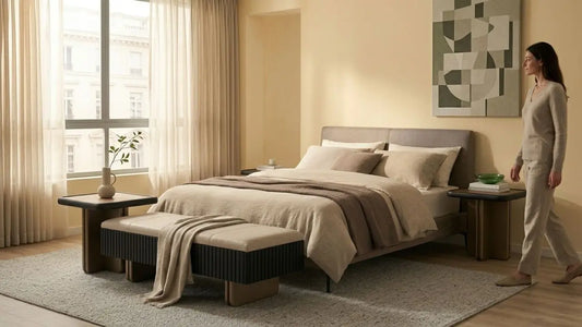 Elegant bedroom showing how to style a bench at the foot of a bed with bedside tables