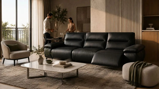 Black leather recliner sofa in an Italian-inspired living room styled with extra seating for festive guests