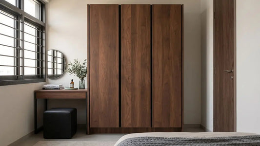 Built-in wood wardrobe in a Singapore bedroom with a compact vanity beside the window.