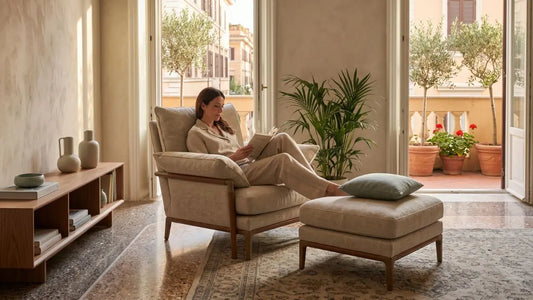 Comfortable upholstered armchair with ottoman in a calm Italian-inspired living room, showing relaxed everyday seating comfort.