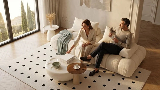 Couple relaxing on a modular sofa layout designed to adapt as the living space grows