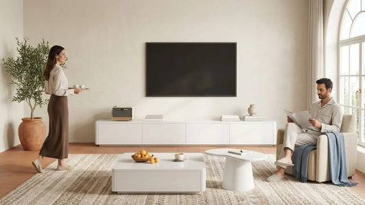 Custom carpentry consultation in a Singapore living room with homeowners reviewing design plans for a built-in TV console