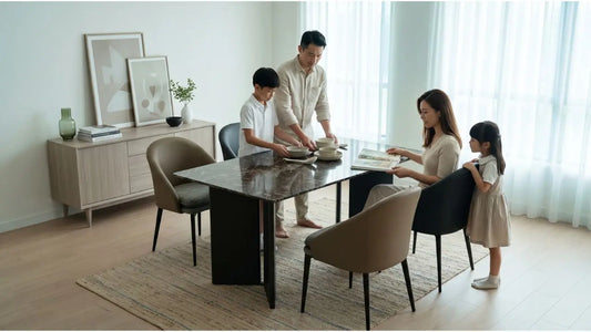 Family setting bowls on a dark rectangular dining table in a compact four-room HDB dining room