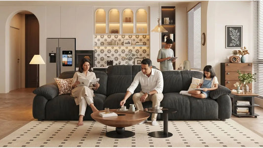 Family relaxing on a dark grey sofa in a Singapore living room with warm wood, black accents, and matched furniture finishes
