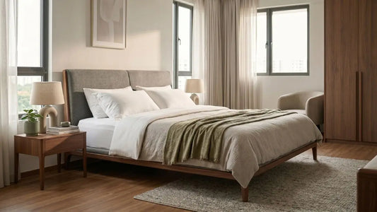 King-size bed frame in a calm five-room HDB master bedroom with wardrobe, bedside table, and soft natural daylight