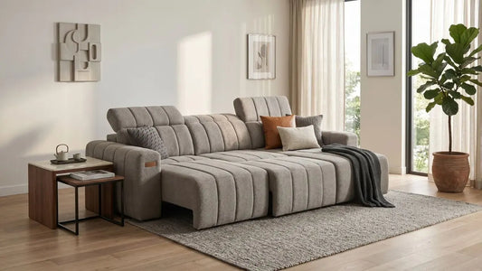 Grey sofa bed styled in a modern Singapore condo living room with two people relaxing