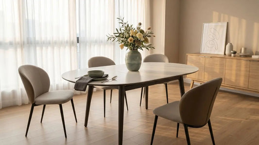 Extendable dining table styled for hosting in a warm Singapore dining area with upholstered chairs and natural light