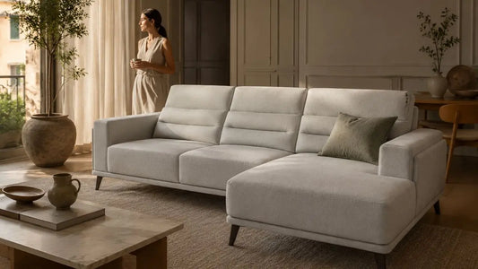 Light grey sectional sofa in an Italian-inspired living room showing balanced proportion and restrained modern furniture styling