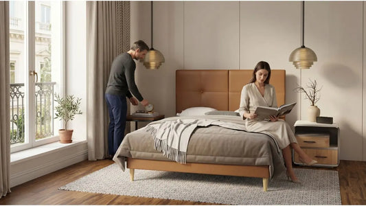 Italian-inspired bedroom with tan upholstered bed frame, matching bedside tables, pendant lights, and coordinated soft textures
