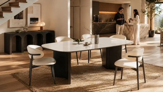 Italian-inspired maisonette dining space with a glossy white dining table, cream chairs, and warm modern interior styling