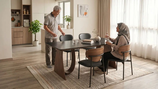 Man measuring dining chair height beside a dining table in a bright Singapore dining room