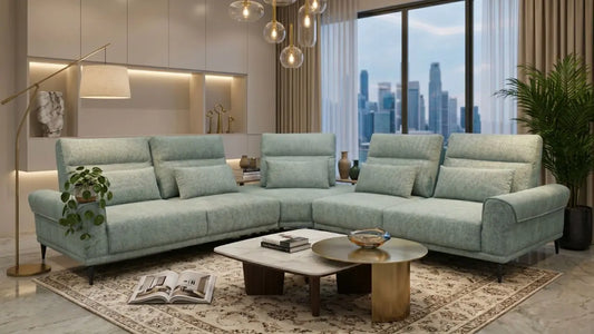 Mint green L-shaped sofa with chaise in a modern Singapore living room with coffee tables and city view