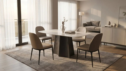 Rectangular marble-look dining table with four chairs in a bright Singapore living-dining space
