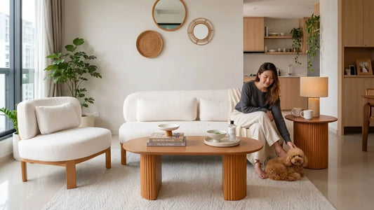 Pet-friendly water-repellent performance fabric sofa in a modern Singapore living room with a cosy cream sofa and dog