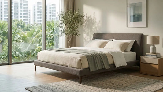 Platform bed with raised legs showing under-bed clearance in a modern Singapore bedroom
