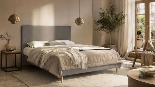 Italian-inspired bedroom with grey upholstered bed and layered neutral bedding for pocket spring vs foam mattress comparison