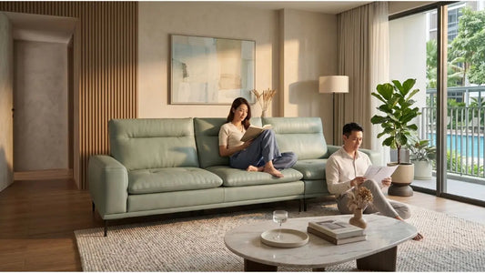 Modern Singapore living room with a sage green sofa, highlighting quality sofa construction and warranty confidence