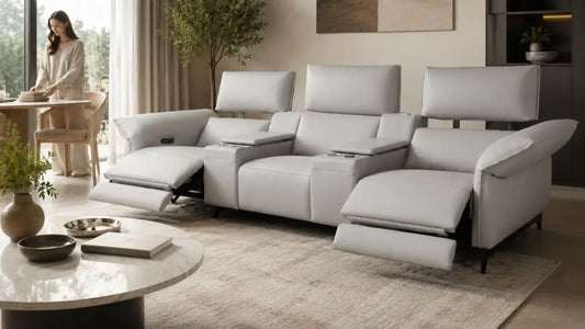 Light grey recliner sofa in a refreshed Italian-inspired living room with warm neutral styling for the new year