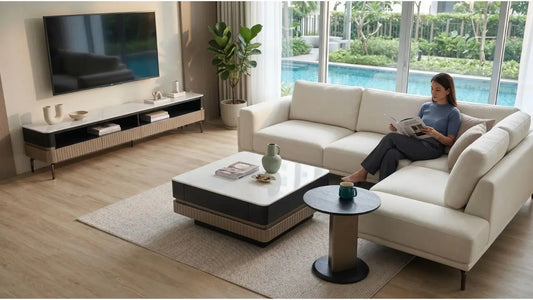 Sectional sofa with white coffee table and round side table in a modern condo living room