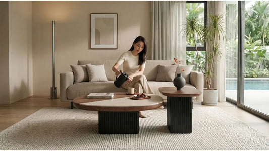 Singapore living room with natural stone coffee tables, beige sofa and warm modern styling