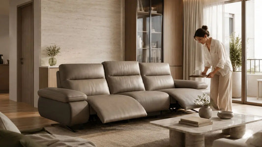 Taupe leather recliner sofa in a warm Italian-inspired serviced condo living room with refined neutral styling