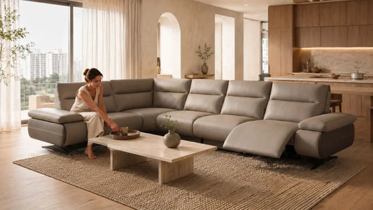 Italian-inspired warm minimalist living room with taupe reclining sectional sofa, natural textures, soft daylight, and refined neutral styling for Singapore homes
