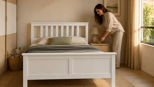 White wooden children’s bed frame in a modern Singapore bedroom with neutral styling and practical storage
